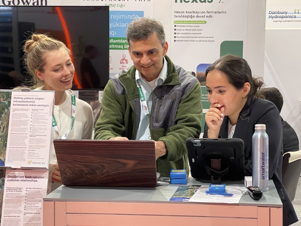 Transparent Path CTO Sunil Koduri demonstrates our visibility platform to Ekaterina Elson (L) and Terra Clark (R) at the 2023 Caspian Agro show.